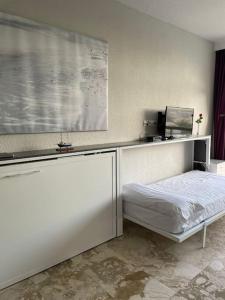 a bedroom with a bed and a window in a room at LOFT CASTILLO SANTA CLARA Torremolinos in Torremolinos