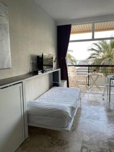 a bedroom with a bed and a balcony at LOFT CASTILLO SANTA CLARA Torremolinos in Torremolinos