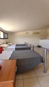 Katil atau katil-katil dalam bilik di Mare e Tranquillità