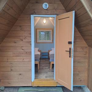 an open door to a room in a attic at Stanica Wodna Płaska in Płaska