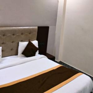 Voodi või voodid majutusasutuse Hotel Hirapanna toas
