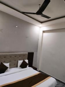 Voodi või voodid majutusasutuse Hotel Hirapanna toas