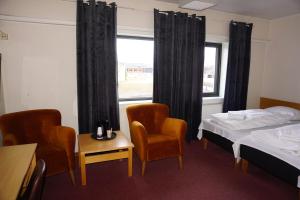 Postel nebo postele na pokoji v ubytování Verdde Hotel Lakselv