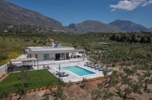 an aerial view of a house with a swimming pool at Demar Exclusive Villa in Plakias