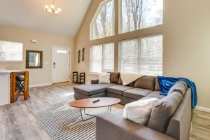 a living room with a couch and a table at Pocono Lake Vacation Rental Community Amenities! in Pocono Lake