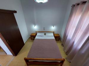 a hospital room with two beds and curtains at Anthy Villas department 1 in Mardhátion