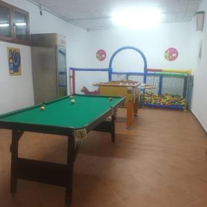 a billiard table in a room with a pool table at Casa Rural El Pescador 