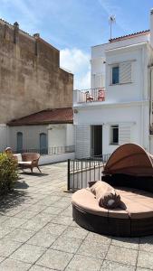a large bed on a patio in front of a building at FAMILY Homefromhomees in Sant Feliu de Guixols