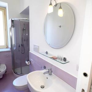 a bathroom with a sink and a mirror at Agriturismo Le Grottelle in SantʼAgata sui Due Golfi