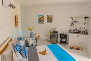 a room with a bed and a table in it at Royal Terrace IV (King) in San Felipe de Puerto Plata