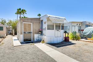 a small house is parked in a driveway at Yuma Getaway with Pool Access, 5 Mi to Lutes Casino! in Yuma