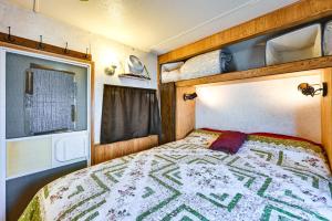 a bedroom with a bed in an rv at Yuma Getaway with Pool Access, 5 Mi to Lutes Casino! in Yuma
