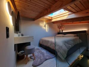 een slaapkamer met een groot bed en een raam bij Matchbox, 4 season house in Rethimnon