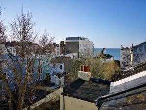 a view of a city with the ocean in the background at The Penthouse 3 Minutes To The Beach, Super Comfy Beds, Part of Burlington-Escapes in Brighton & Hove