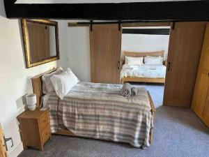 Voodi või voodid majutusasutuse The Vottage - 3 bed cottage toas