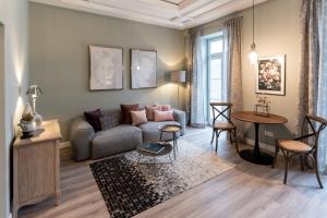 a living room with a couch and a table at Villa Wickenburg in Salzburg