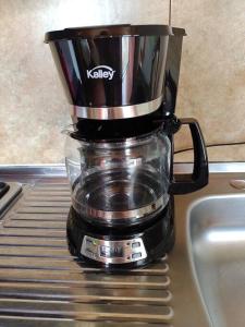 a kuka blender sitting on top of a counter at La casa de chocolate 1 in Bogotá