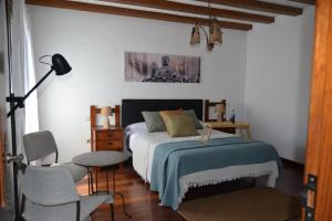 Postel nebo postele na pokoji v ubytování Canto Rojo, La Asomada con vistas a Lobos