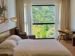 Zhangjiajie National Park Nvue Resorts客房内的一张或多张床位