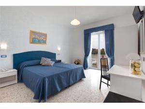 Postel nebo postele na pokoji v ubytování Hotel Britannia