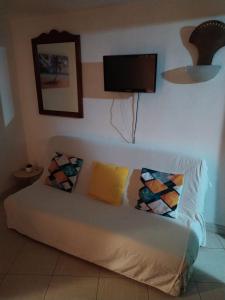 Ένα ή περισσότερα κρεβάτια σε δωμάτιο στο La Martiniquaise