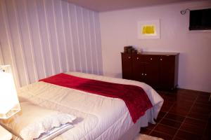 Cama ou camas em um quarto em Casa de Vidro cercada por Araucárias