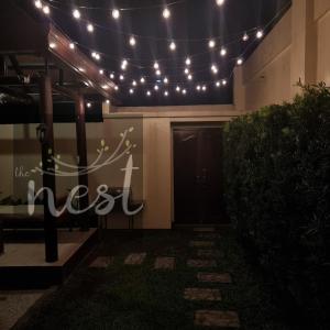 a front door of a building with a bunch of lights at The Nest at Luana in Porac