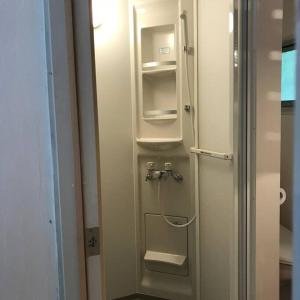 a bathroom with a refrigerator with two shelves at １日1組様限定　「ほしな屋」 in Nagano