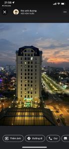 a view of a tall building with a city at Happy House Homestay 2 in Hue