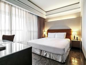 Postel nebo postele na pokoji v ubytování Leofoo Residences