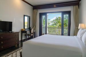 Postel nebo postele na pokoji v ubytování Tahiti Resort + 37 fotografií
