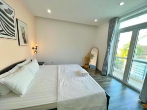 Giường trong phòng chung tại Vung Tau Beach Villa- Back Beach Villa- 4 Bedrooms Villa