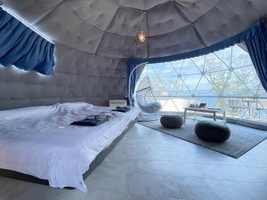Voodi või voodid majutusasutuse Nishiizu Glamping Tenkuuterrace toas
