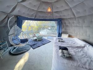 Voodi või voodid majutusasutuse Nishiizu Glamping Tenkuuterrace toas