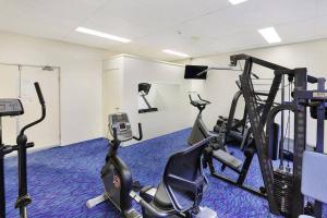 a gym with two exercise bikes and a treadmill at 1 Bedroom Central Mooloolaba Resort with Pool, Spa, Mini Golf in Mooloolaba
