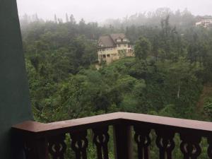 a view from a balcony of a house on a hill at Carol Crosswinds Tagaytay in Cavite +9 photos