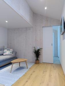 Televízia a/alebo spoločenská miestnosť v ubytovaní Lagom Haus