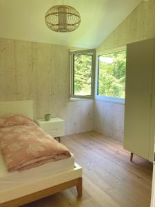 Posteľ alebo postele v izbe v ubytovaní Lagom Haus