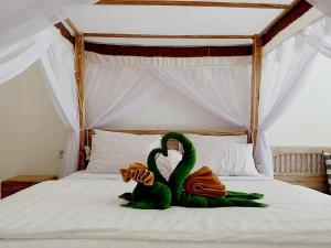 Ein Bett oder Betten in einem Zimmer der Unterkunft Sama Sama Amed