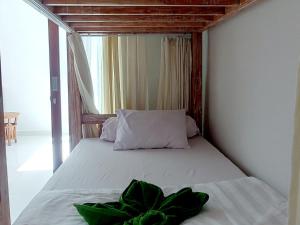 Ein Bett oder Betten in einem Zimmer der Unterkunft Sama Sama Amed