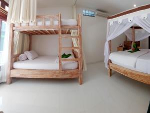 Ein Bett oder Betten in einem Zimmer der Unterkunft Sama Sama Amed