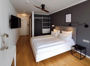 Postel nebo postele na pokoji v ubytování DK Hotel Heidelberg