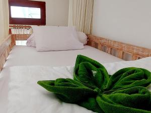 Ein Bett oder Betten in einem Zimmer der Unterkunft Sama Sama Amed