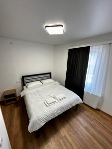 Postel nebo postele na pokoji v ubytování Mtskheta Family Stay