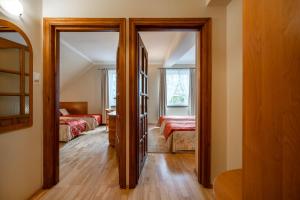 Postel nebo postele na pokoji v ubytování Lech Resort & Spa