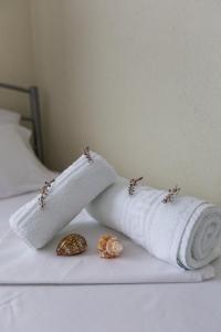 Postel nebo postele na pokoji v ubytování Kasimidis Apartments
