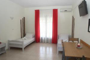 Postel nebo postele na pokoji v ubytování Kasimidis Apartments