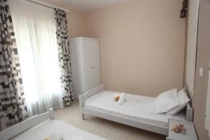 Postel nebo postele na pokoji v ubytování Kasimidis Apartments