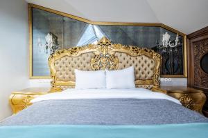 a bedroom with a bed with a gold headboard at Magnificent Studio Flat in Uskudar in Istanbul