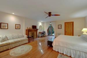 a living room with a bed and a couch at Home NYC in New York